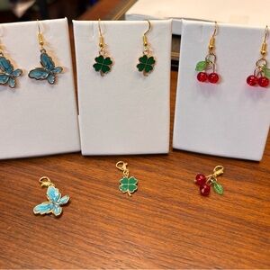 9 pc new set includes 3 pairs of earrings with matching pendant charms